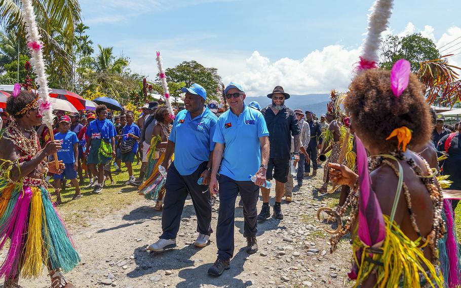Australian Prime Minister Anthony Albanese, centre right, walks with Papua New Guinea Prime Minister James Marape as they start their trek along the Kokoda Track at Kokoda Village, Papua New Guinea, Tuesday, April 23, 2024. 