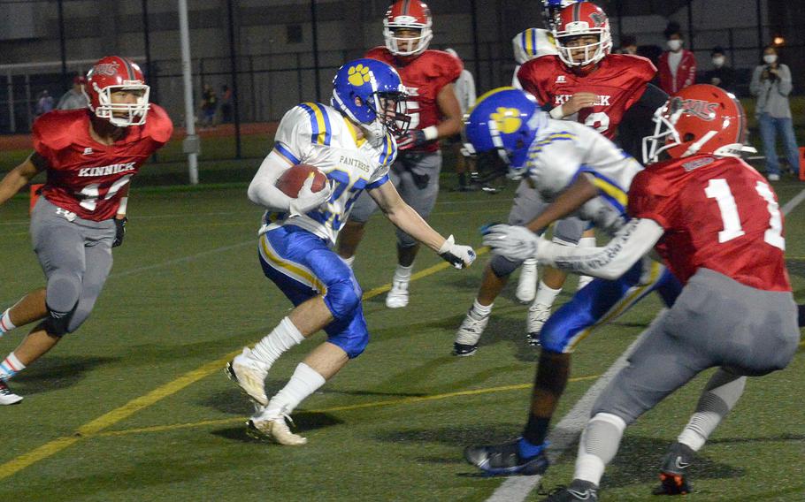 Yokota running back Owen Taylor looks for running room against the Nile C. Kinnick defense.