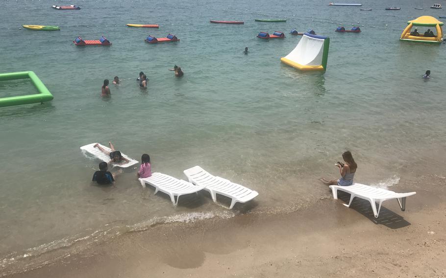 The water at All Hands Beach in the Philippines is a picturesque turquoise with several inflatable features to enjoy. 