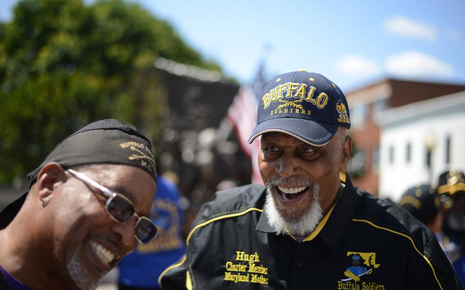 Hugh Valentine, 91, right, laughs while greeted by members of the Buffalo Soldiers motorcycle club at the African American Civil War Memorial in Washington on May 29. 