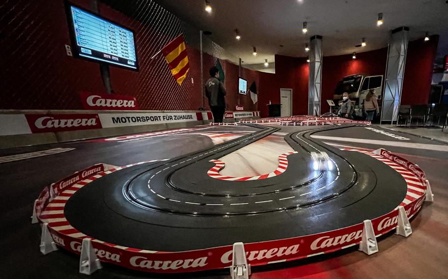 Children play with a Carrera slotcar replica of the Nuergburgring racetrack in Nuerburg, Germany, Jan. 15, 2022. 