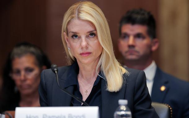 Pam Bondi seated at a hearing.