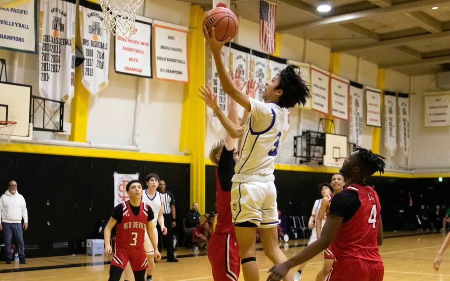 St. Mary's Towa Miyoshi goes up to shoot against Nile C. Kinnick. Miyoshi hit the game-winning basket as the Titans won the ASIJ Kanto Classic boys final 40-38. Miyoshi was named the tournament's MVP.