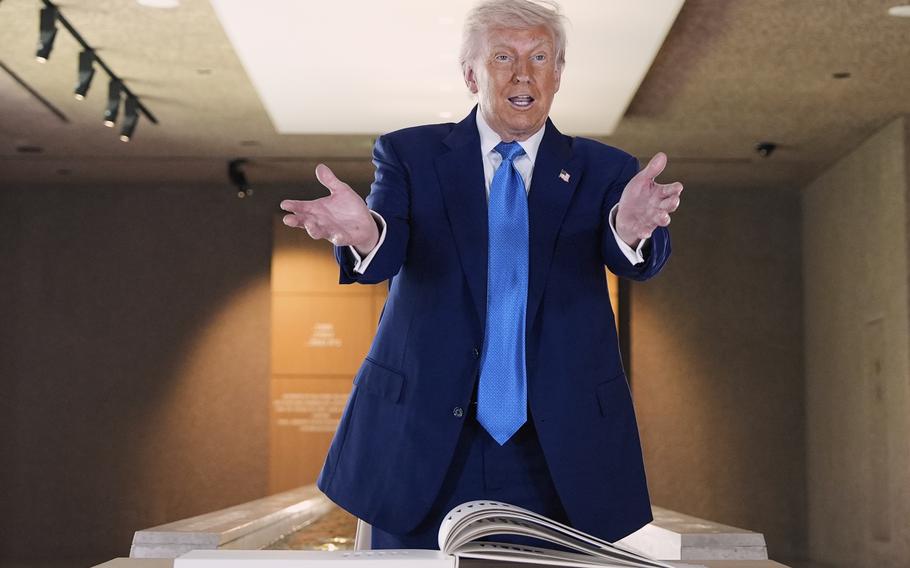 President Trump with his hands extended out.