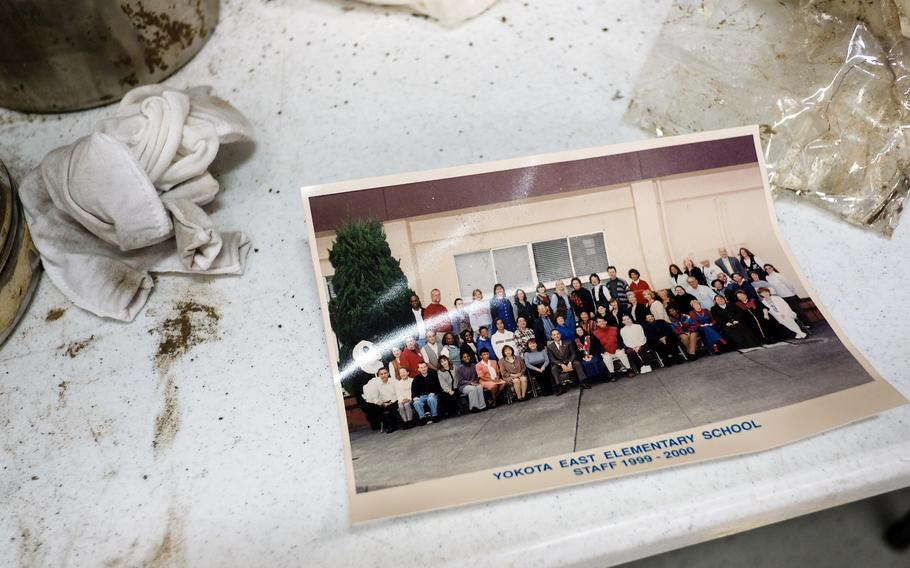 A group photo is labeled “Yokota East Elementary School Staff 1999-2000.”