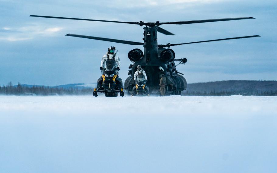 U.S. Army Special Forces and Danish special operators learn how to load and unload snowmobiles onto a CH-47G helicopter at Fort Wainwright, Alaska, on Feb. 23.