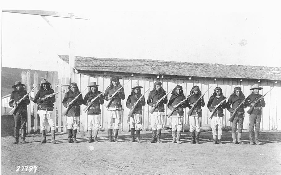 A group of Apache scouts drills with rifles at Fort Wingate, N.M., in an undated photo.