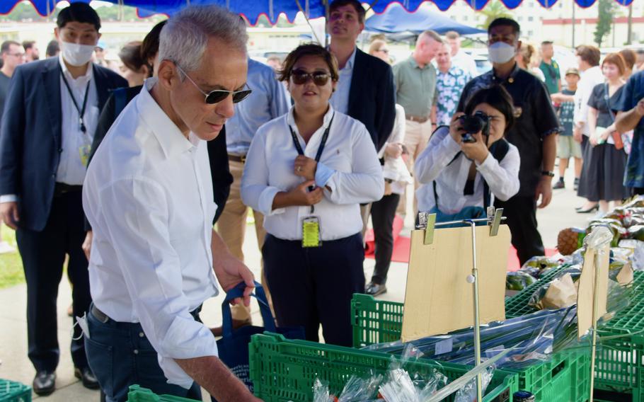 U.S. Ambassador to Japan Rahm Emanuel looks over vegetables at the farmers market at Camp Hansen, Okinawa, on Oct. 31, 2022.