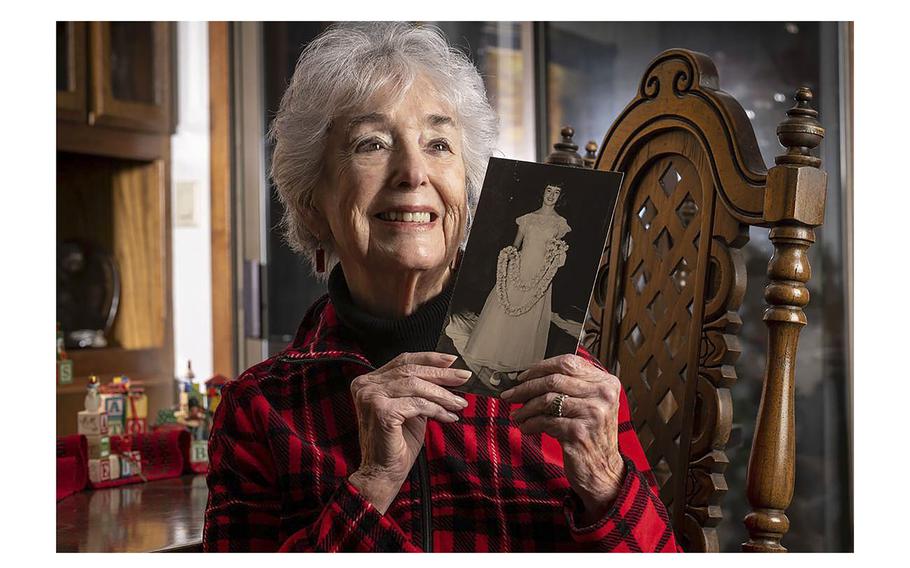 Toni Bone, 91, holds a photo Tuesday, Dec. 6, 2022, at her home in Sacramento of herself when she was younger and lived in Hawaii. She lived in Honolulu, Oahu during the attack on Pearl Harbor. “The sound of the explosions coming from Pearl Harbor was very alarming and scary,” she said. 