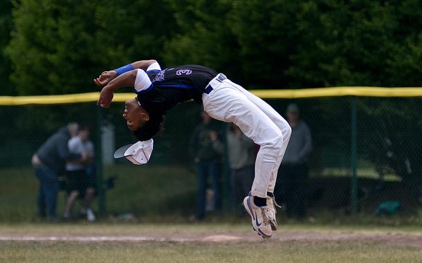 Ramstein pitcher Christian Roy flips after he struck out a Kaiserslautern batter for the final out during the Division I title game at the 2025 DODEA European baseball championships on May 23, 2025, at Southside Fitness Center on Ramstein Air Base, Germany.