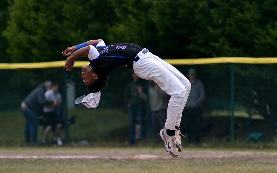 Ramstein pitcher Christian Roy does a back flip after he struck out a Kaiserslautern batter for the final out during the Division I title game at the 2025 DODEA European baseball championships on May 23, 2025, at Southside Fitness Center on Ramstein Air Base, Germany.