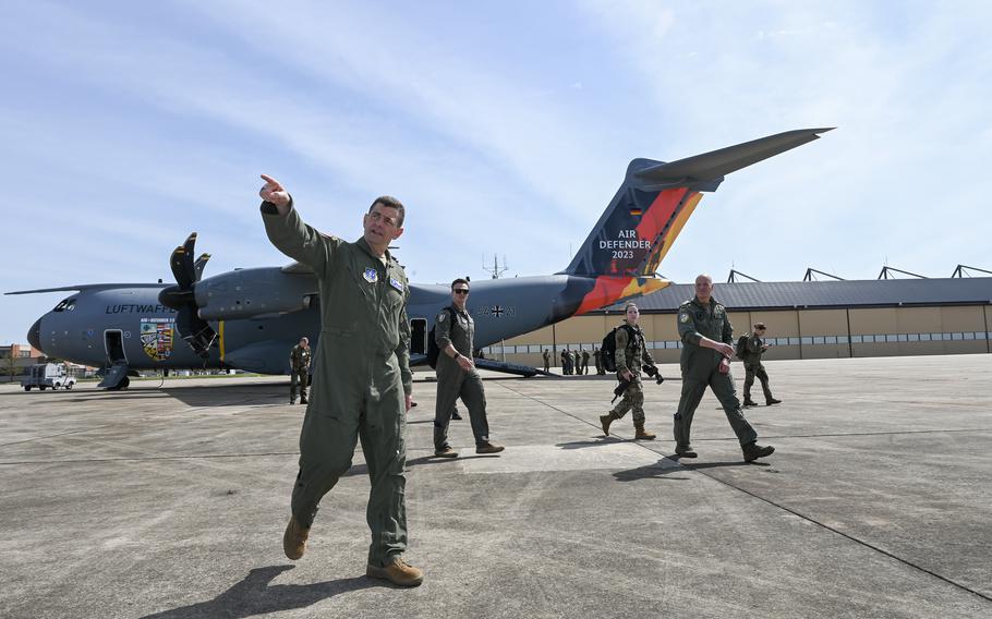 Lt. Gen. Michael Loh, front, director of the U.S. Air National Guard, tours the flight line at Joint Base Andrews, Md., April 4, 2023. Members of the German air force, including air chief Lt. Gen. Ingo Gerhartz, second from right, visited the U.S. in preparation for Air Defender 2023. 