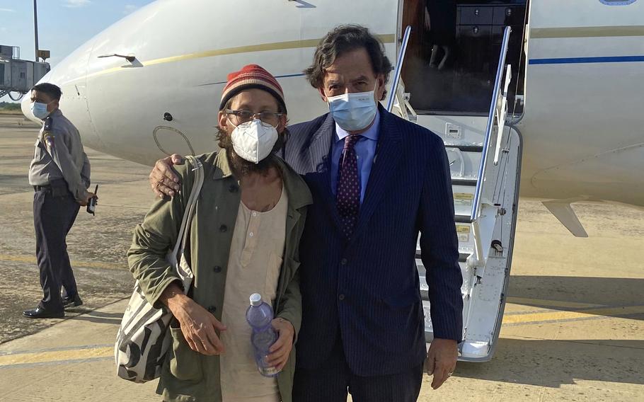 In this photo provided by the Richardson Center, former U.S. Ambassador to the U.N. Bill Richardson, right, poses with journalist Danny Fenster in Naypyitaw, Myanmar, Monday, Nov. 15, 2021. Fenster, sentenced only days ago to 11 years of hard labor in military-ruled Myanmar, was freed and on his way home Monday, a former U.S. diplomat who helped negotiate the release said.