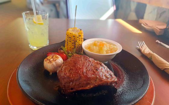 A top blade, 10-ounce steak, medium rare, with cheesy mashed potatoes, grilled green beans and grilled corn on the cob from the O House Restaurant at Osan Air Base, South Korea. 