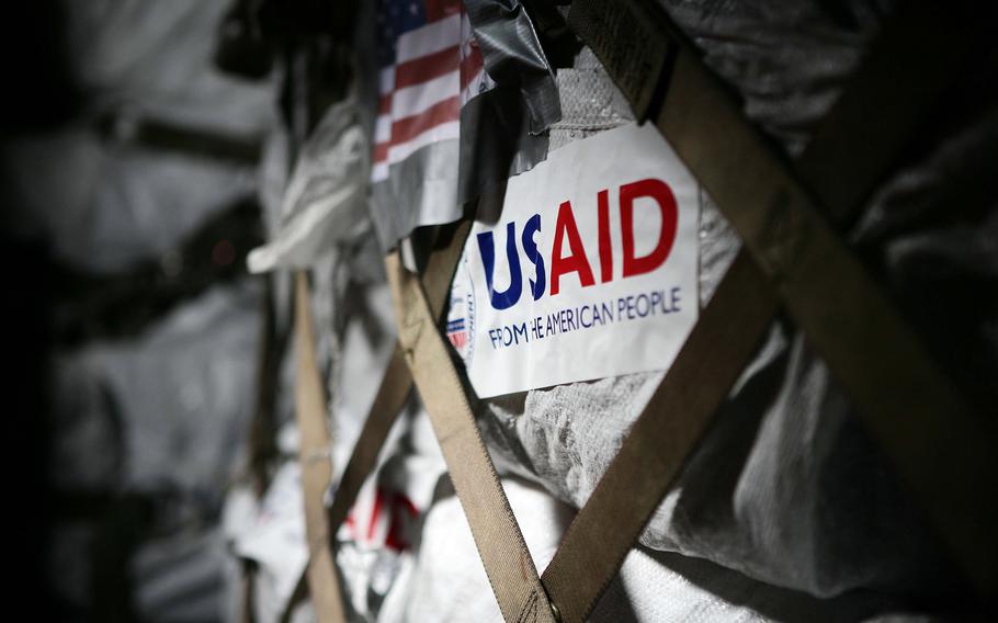 Aid provided by the U.S. Agency for International Development arrives aboard a U.S. Air Force C-130 Hercules at the Yangon International airport in Burma. The aid, consisting of water, food and medical supplies, is being transported as part of Joint Task Force Caring Response, a multi-service humanitarian assistance and disaster relief effort for Burmese citizens devastated by the recent cyclone. 