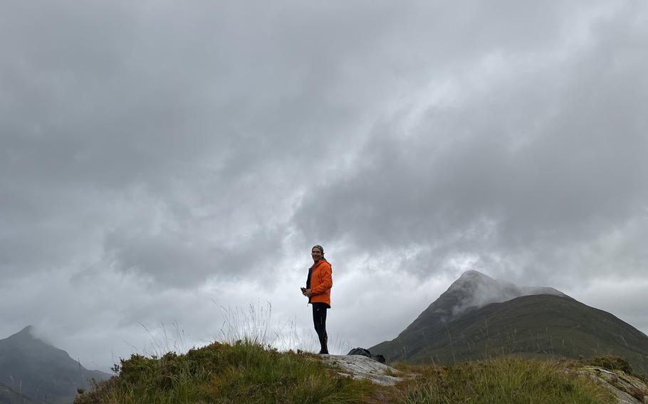 The author’s husband stands on a rocky ridge high above Kinlochleven overlooking Loch Leven on the way to Fort William. 