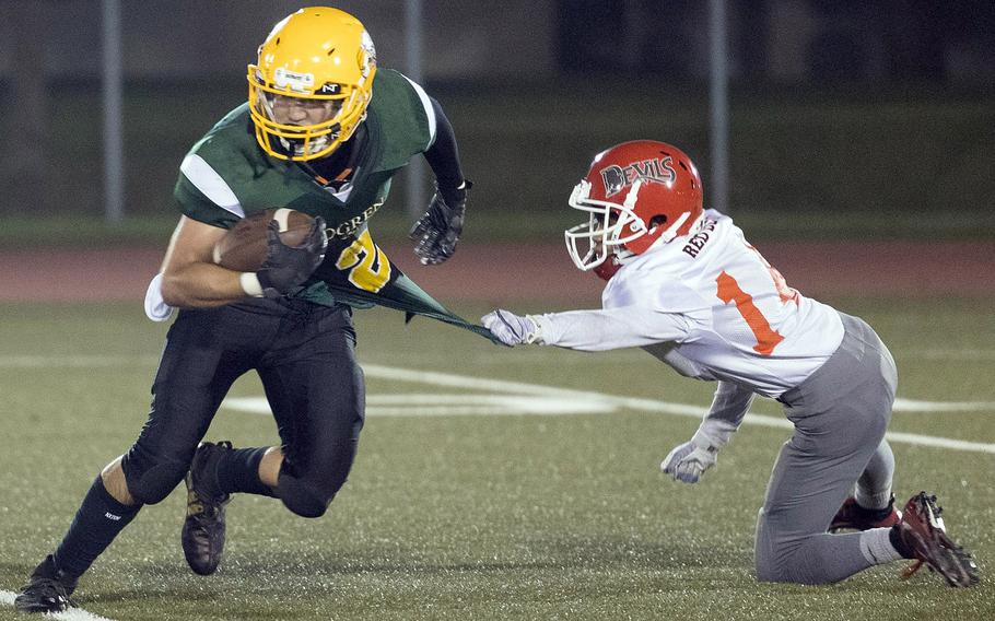 Nile C. Kinnick's Michael Lozano grabs the jersey of Robert D. Edgren's Evan Moreno.