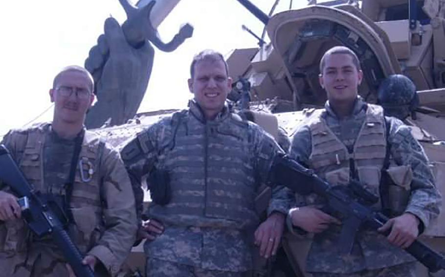 Brandon Harris, left, is pictured in Baghdad, Iraq, during his first combat deployment in 2006. Harris, now a sergeant first class, enlisted right after graduating high school in 2004, inspired largely by the 9/11 terrorist attacks.