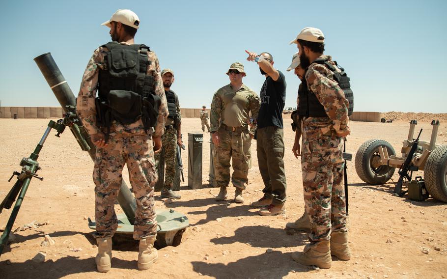 A U.S. soldier discusses mortar operations with Syrian partner forces at Al-Tanf garrison, Syria, in August 2022. 