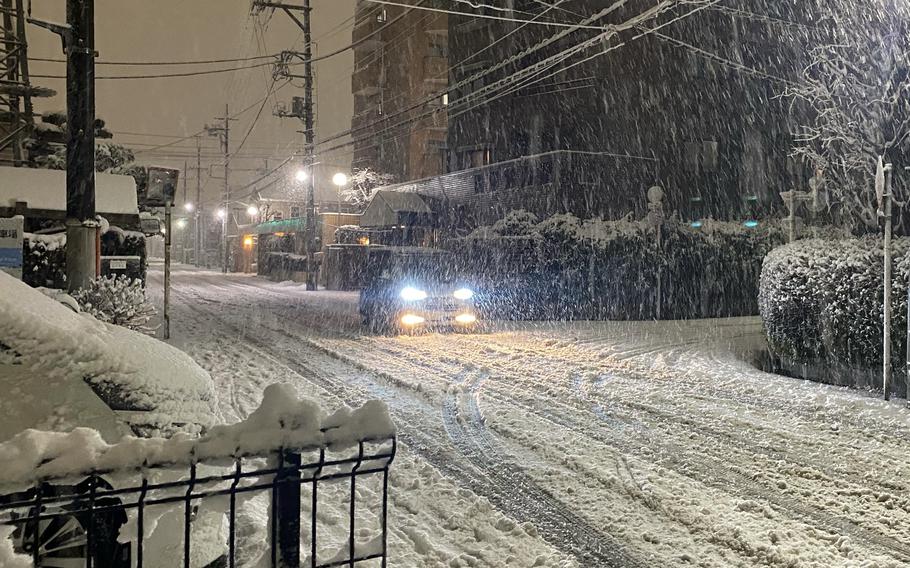 Snowfall accumulates in a neighborhood just outside Yokota Air Base, Japan, Monday, Feb. 5, 2024. 