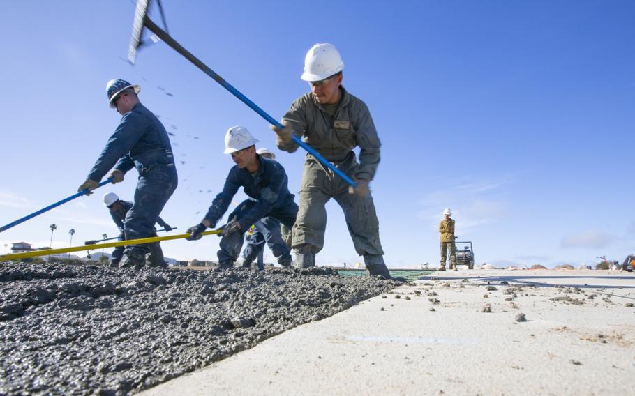 U.S. Marines prepare and spread concrete during the “Catalina Island Airport in the Sky” project at Catalina Island, California in 2019, the first of two projects on the island so far. 