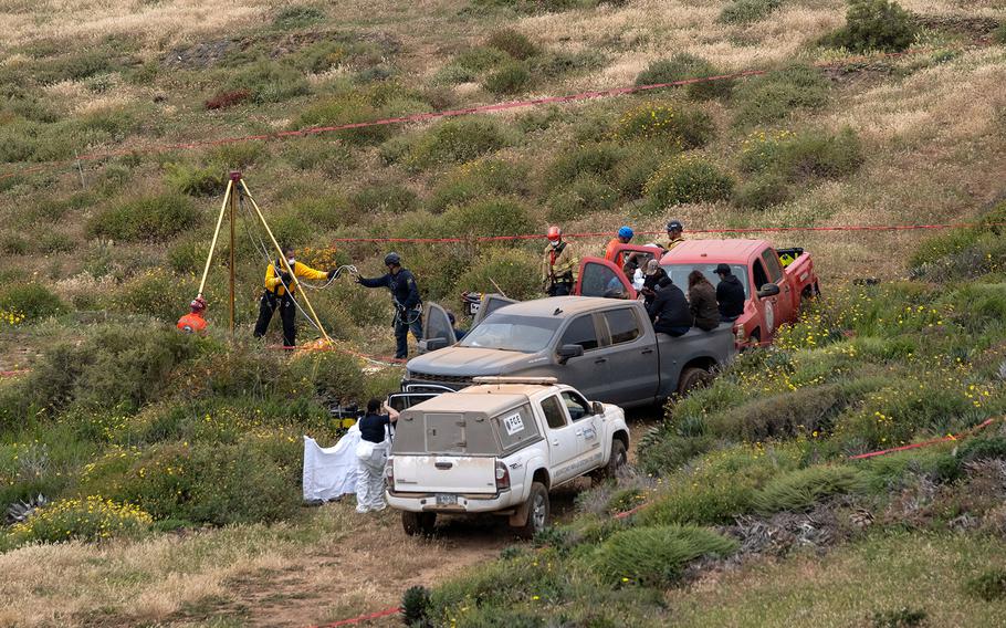 Rescue workers, forensics, and prosecutors work in a waterhole where human remains were found near La Bocana Beach, Santo Tomas delegation, in Ensenada, Mexico, on May 3, 2024. 