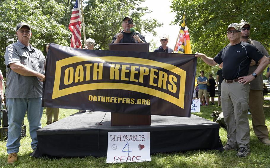 FILE - Stewart Rhodes, founder of the citizen militia group known as the Oath Keepers, center, speaks during a rally outside the White House in Washington, on June 25, 2017. The seditious conspiracy case filed this week against members and associates of the far-right Oath Keepers militia group marked the boldest attempt so far by the government to prosecute those who attacked the U.S. Capitol during the Jan. 6 riot. 
