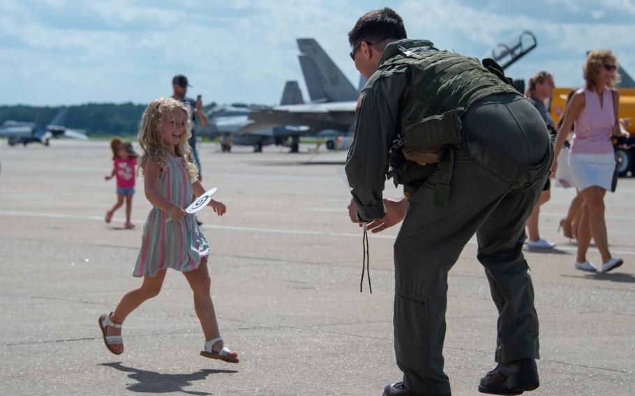 Families welcome home sailors assigned to the “Screwtops” of Airborne Command and Control Squadron 123 on Naval Air Station Oceana during the squadron’s homecoming on July 12, 2021. 