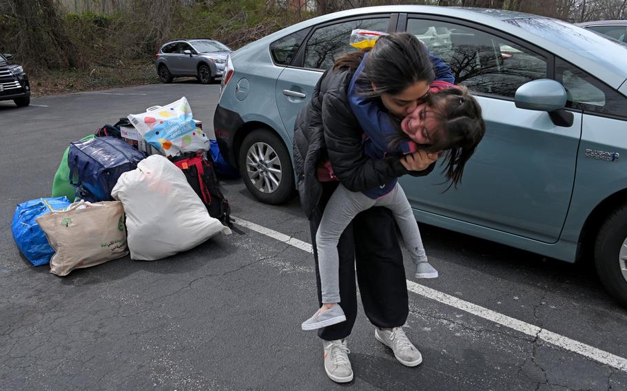 Shkula Zadran kisses her niece, Hareer Zadran, 4, as they get ready to move into an apartment in Howard County after staying in a hotel for months after fleeing Afghanistan.