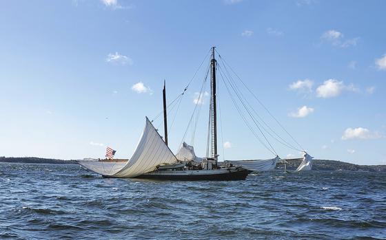 A boat with a broken mast at sea in Maine.