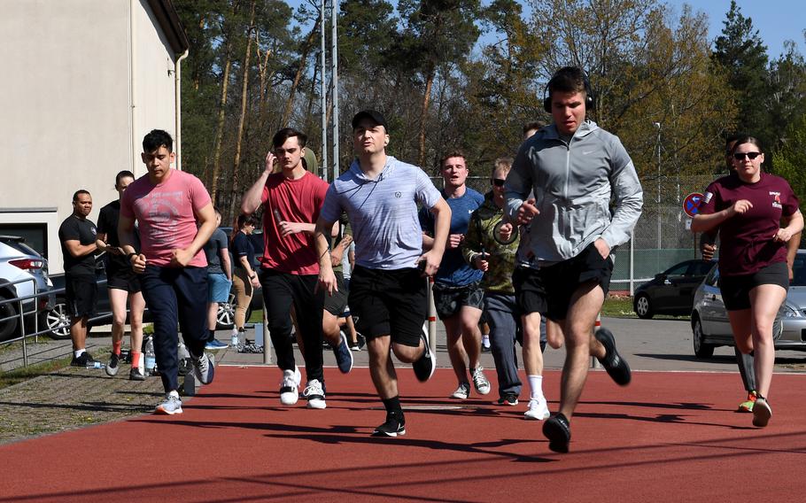 Members of the 86th Security Forces Squadron run at Ramstein Air Base, Germany, April 20, 2022. Base officials are investigating allegations put forth on social media accusing a security forces airman of offering a bribe to pass a physical training test.