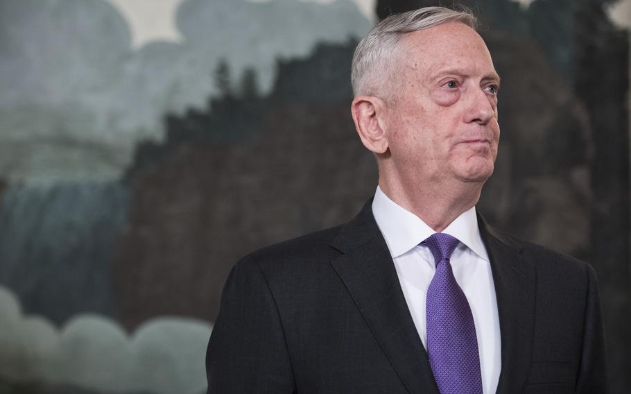 Defense Secretary Jim Mattis listens in March 2018 as President Donald Trump speaks at the White House. Mattis did not publicly reveal his consulting job for the UAE when he returned to the Pentagon in January 2017. 