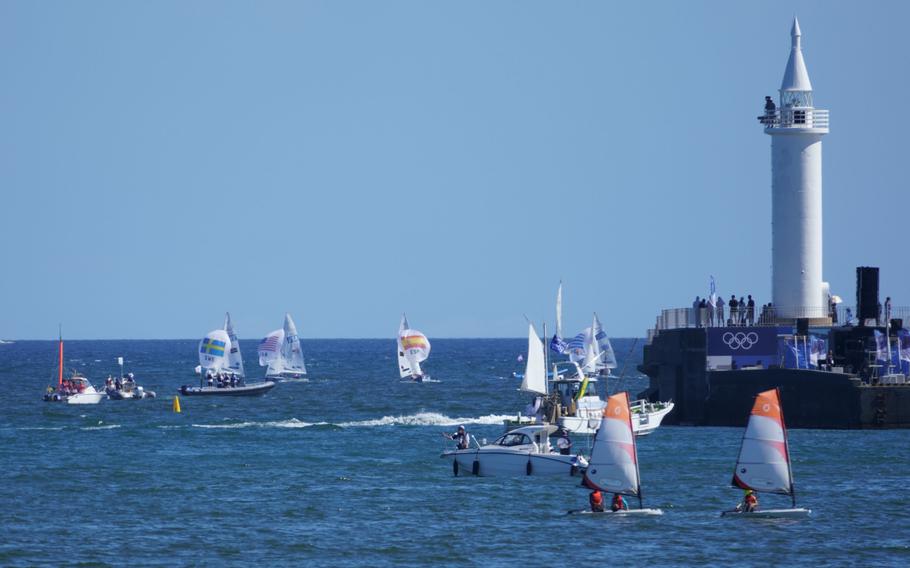 Teams compete in an Olympic sailing event off Enoshima, Japan, Wednesday, Aug. 4, 2021. 