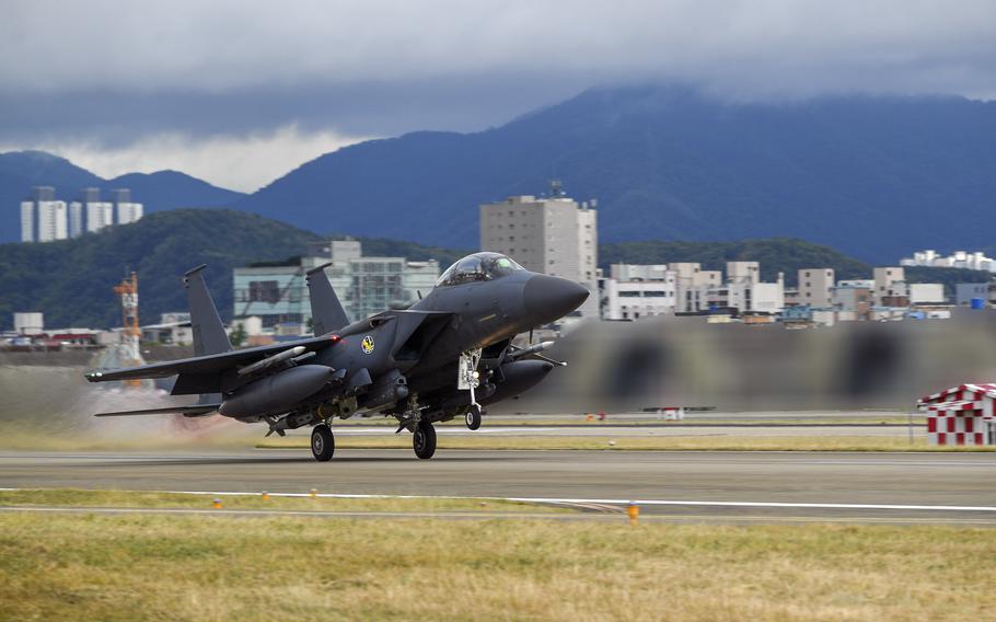 A South Korean F-15K Slam Eagle takes part in a bombing drill with U.S.Air Force F-16 Fighting Falcons following a North Korean missile test, Tuesday, Oct. 4, 2022. 