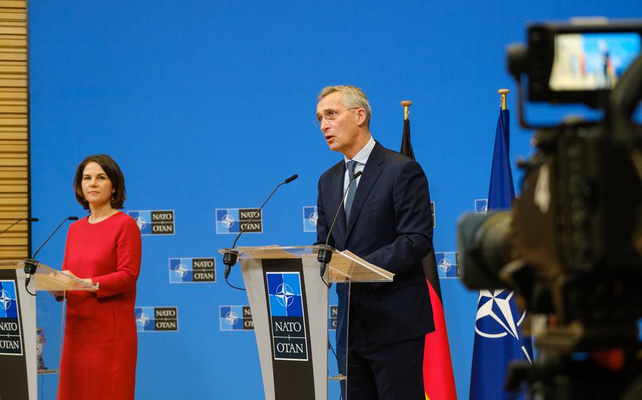 NATO Secretary General Jens Stoltenberg and German Foreign Minister Annalena Baerbock speak to the media at NATO Headquarters in Brussels on Dec. 9, 2021. Baerbock, a member of the Green party, became foreign minister on Dec. 8.