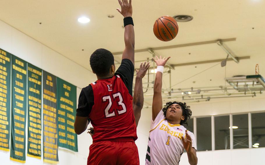 Nile C. Kinnick's Misiah Morizane and Robert D. Edgren's Micah Magat go up for the ball during Friday's DODEA-Japan boys basketball game. The Red Devils won 80-78.