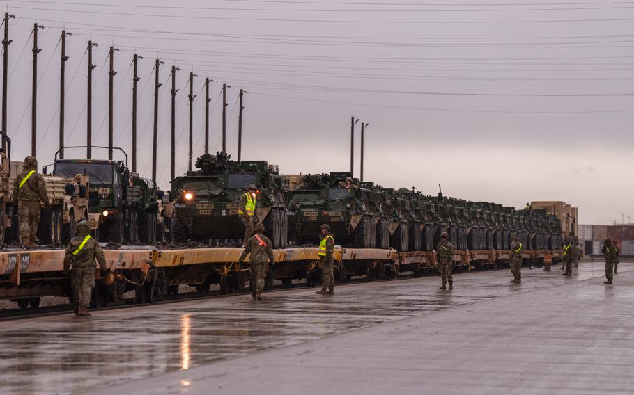 Army personnel unload a shipment of Strykers at a rail head within Fort Bliss in El Paso.