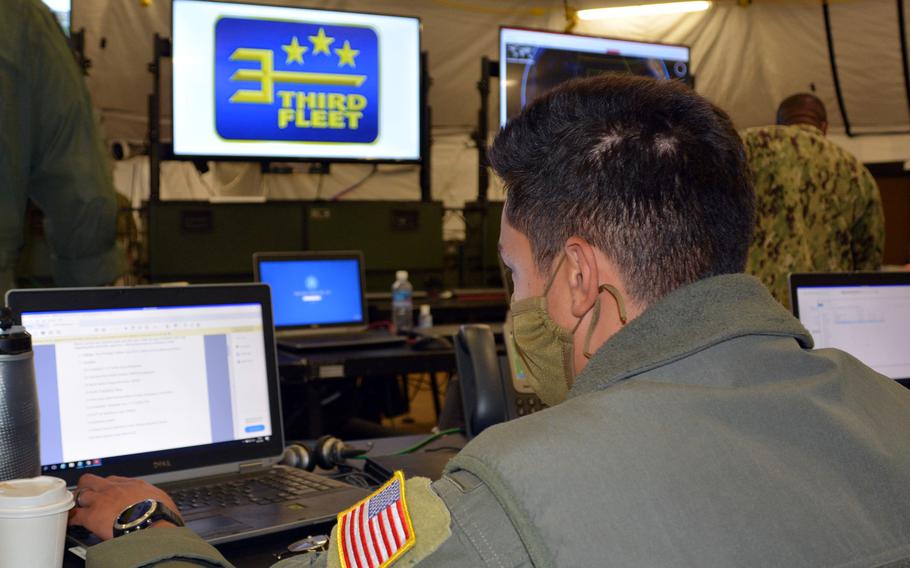 A sailor monitors a computer on the watch floor of 3rd Fleet’s expeditionary maritime operations center at Joint Base Pearl Harbor-Hickam, Hawaii, Monday, Aug. 9, 2021.