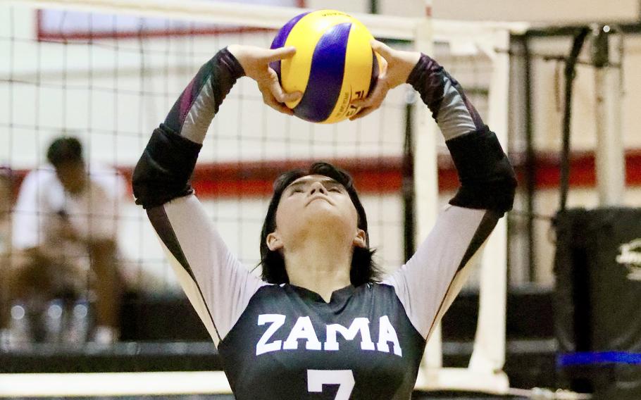 Zama's Remi Sherratt sets the ball against Robert D. Edgren. The Trojans won both weekend matches, Friday's match in four sets and Saturday's in three.