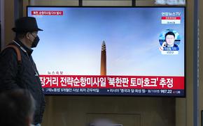 A TV screen is seen reporting North Korea's missile launch during a news program at the Seoul Railway Station in Seoul, South Korea, Wednesday, March 22, 2023. 