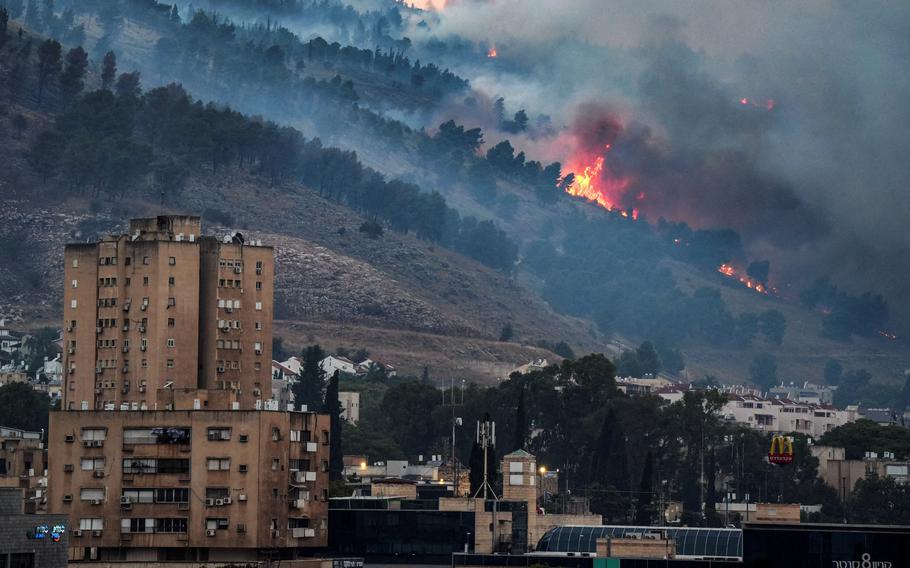 Smoke and fire covers the area following rocket attacks from Lebanon amid ongoing cross-border hostilities between Hezbollah and Israeli forces, near Kiryat Shmona, Israel, close to its border with Lebanon, June 3, 2024. 