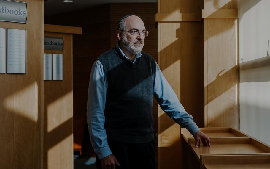 Howard Oster in the library of the hospital where he works in Tel Aviv. He was at work when he learned this his son Amichai had been killed on New Year’s Day while fighting in the Gaza Strip.  
