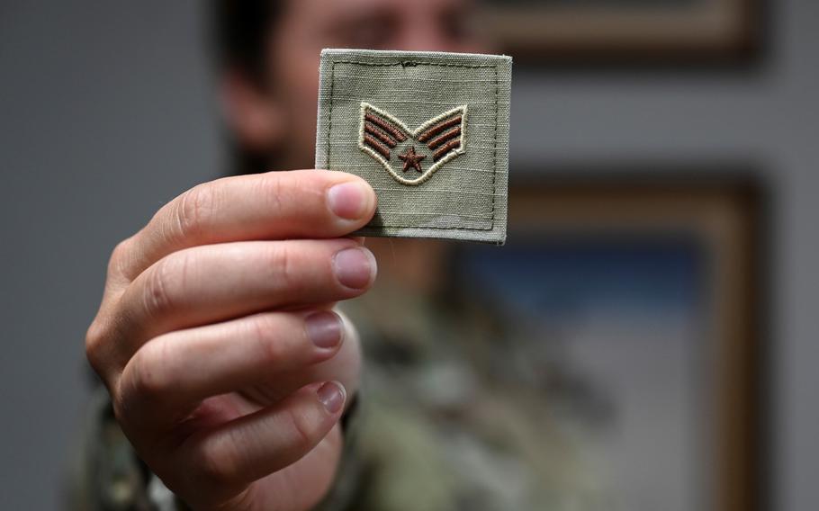 An airman 1st class with the 33rd Fighter Wing shows off a senior airman patch to indicate an upcoming rank advancement. 