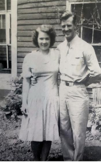 A woman and a man stand together and pose for a picture