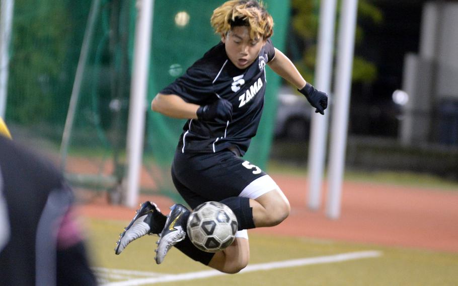 Zama’s Kaisei Muta tries to settle the ball against Matthew C. Perry during Friday’s DODEA-Japan boys soccer match. The Trojans won 2-1.