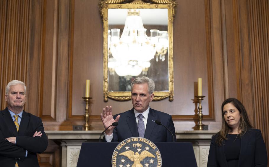 Flanked by Majority Whip Rep. Tom Emmer (R-Minn.) and Conference Chair Rep. Elise Stefanik (R-N.Y.), House Speaker Kevin McCarthy (R-Calif.) speaks during a news conference Saturday after the House passed a continuing resolution that would fund the government for 45 days.