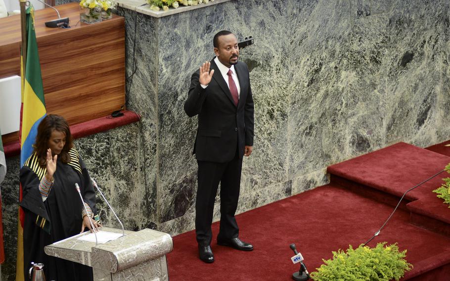 Ethiopia’s Prime Minister Abiy Ahmed is sworn in for a second five-year term, at the House of Peoples Representatives in the capital Addis Ababa, Ethiopia Monday, Oct. 4, 2021. Prime Minister Abiy Ahmed has gone to the battlefront to lead his country’s military forces, his government announced Wednesday, Nov. 24, 2021.
