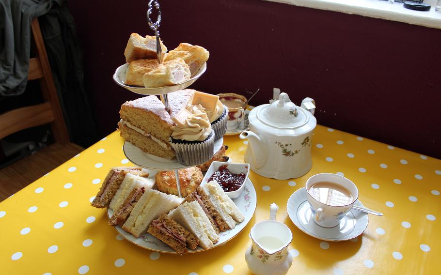 A variety of cakes and sandwiches accompany a traditional afternoon tea service at Barleycorn in Mildenhall, England, on May 24, 2021.