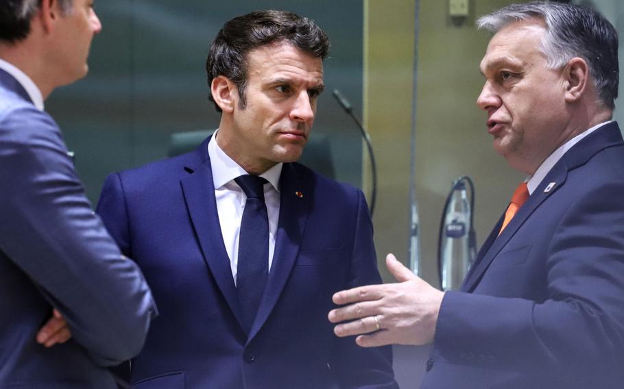 Emmanuel Macron, France’s president, center, and Viktor Orban, Hungary’s prime minister, at a European Union leaders summit to discuss security and defense in Brussels on March 25, 2022.