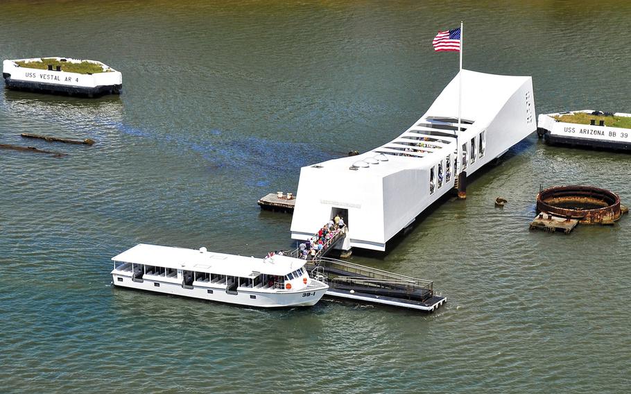 An aerial view of the USS Arizona Memorial taken March 30, 2014, shows the pair of white quays that anchored the battleship.